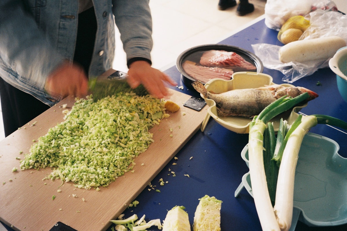 Fresh herb and vegetable soup in white bowl